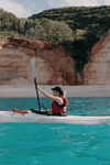 gif of woman kayaking on her coast xt kayak on water