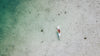 Top view of a person kayaking on a body of water