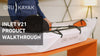 A person holding a kayak on the table